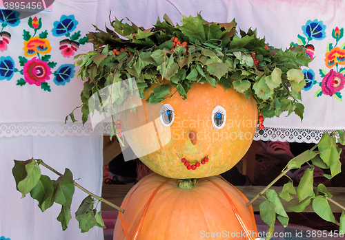 Image of A fun figurine made of two pumpkins in the form of a girl.