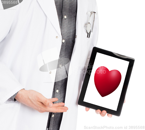 Image of Doctor holding tablet - Red heart