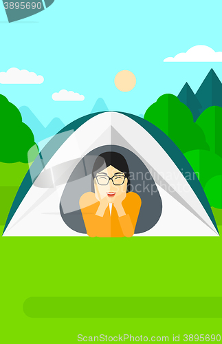 Image of Woman lying in tent.