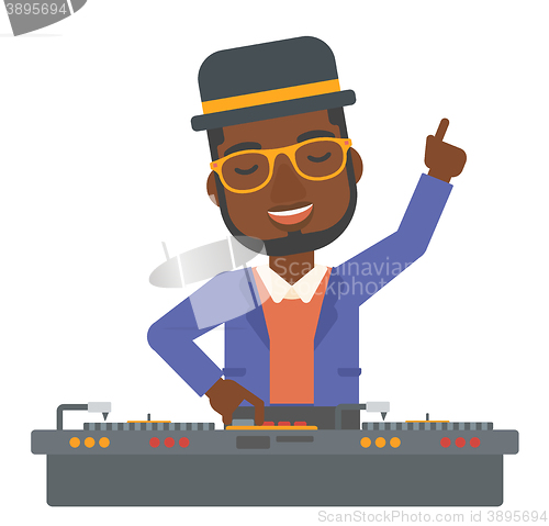 Image of Smiling DJ with console.