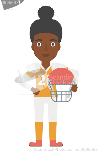 Image of Rugby player with ball and helmet in hands.