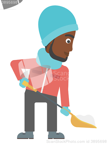 Image of Man shoveling and removing snow.