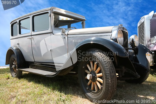 Image of vintage car on wooden wheel