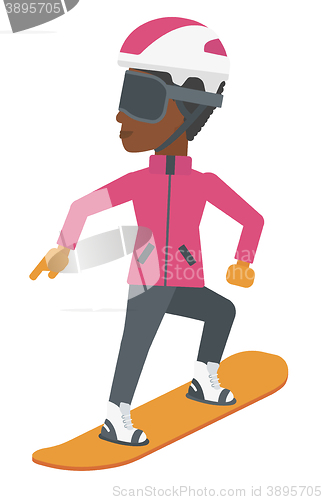 Image of Young woman snowboarding.