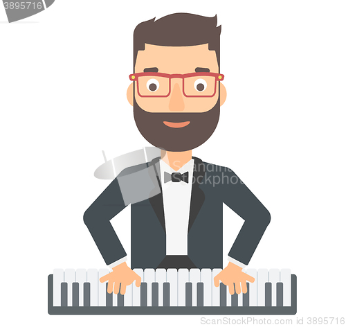 Image of Man playing piano.