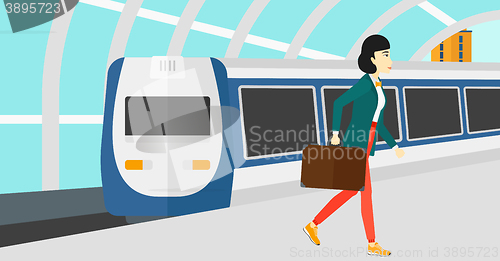 Image of Woman going out of train.