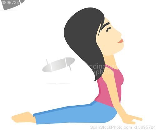 Image of Woman practicing yoga.