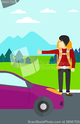 Image of Young man hitchhiking.