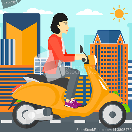 Image of Woman riding scooter.