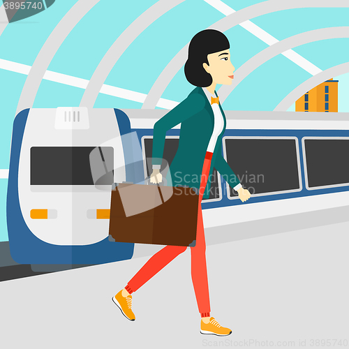 Image of Woman going out of train.