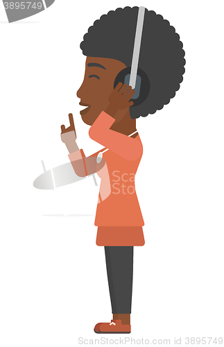 Image of Woman listening music in headphones