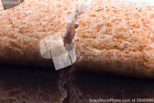 Image of Breaking Bread on a dark glass background