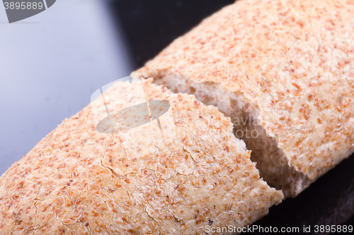 Image of Breaking Bread on a dark glass background