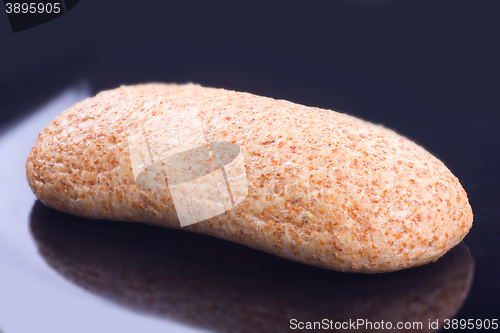 Image of Large loaf of bread on black