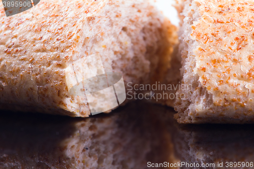 Image of Breaking Bread on a dark glass background