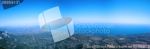 Image of  top of mountain overhanging sea panorama