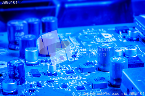 Image of Electronic capacitors and chips on a microboard