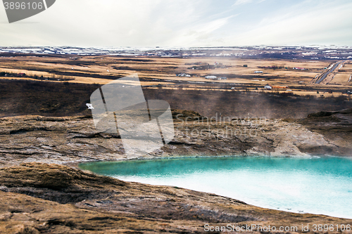 Image of Geysir geyser in Iceland with steamy water