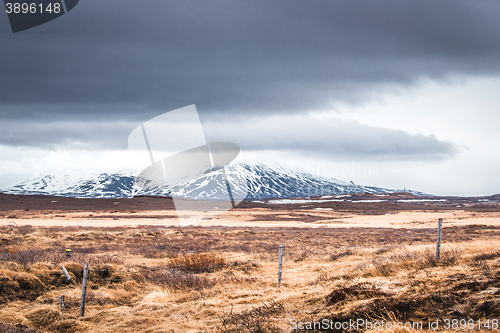 Image of Fence on a field with mountains