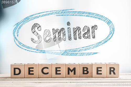 Image of December seminar sign on a stage