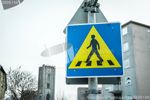 Image of Pedestrian crossing sign in a big city