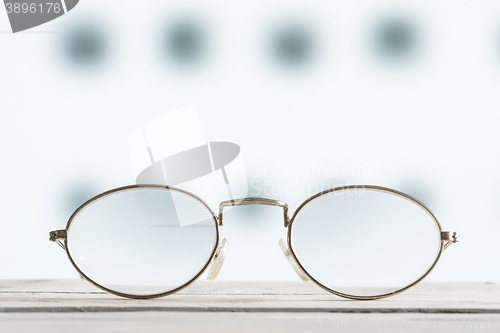 Image of Glasses on a table with blurry background