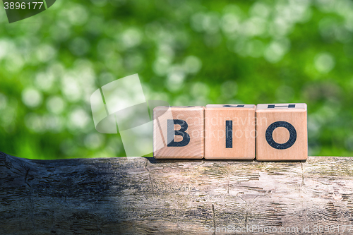 Image of Wooden bio sign in green surroundings