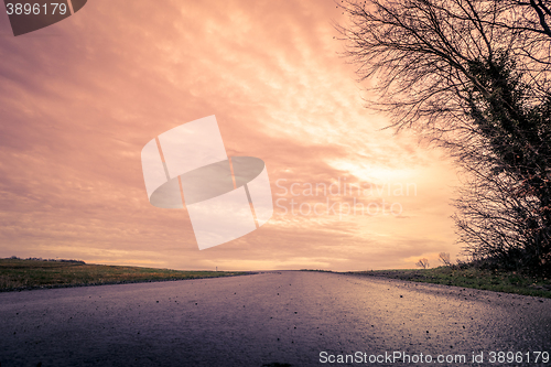 Image of Road made of asphalt in the sunset