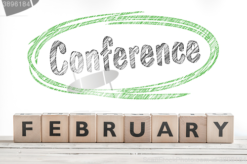 Image of February conference sign made of wood