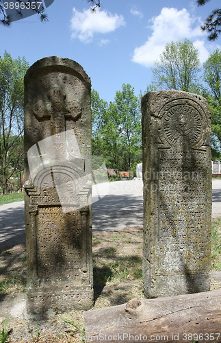 Image of Two tombstones by the road
