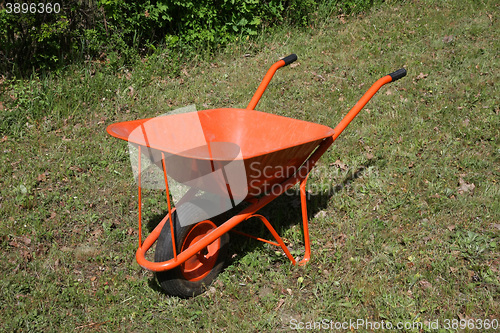 Image of Orange handwagon in the field