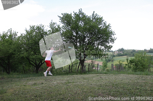 Image of Young man with frisbee