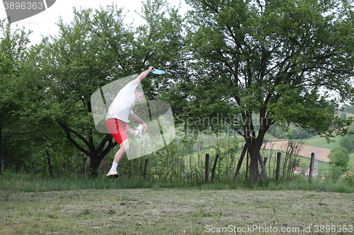 Image of Young man with frisbee