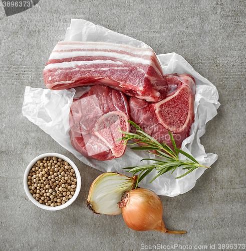 Image of various raw meat cuts and spices
