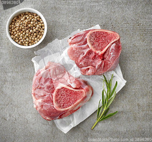 Image of fresh raw meat on white wrapping paper
