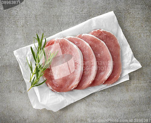 Image of fresh raw pork on white wrapping paper