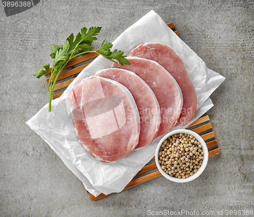 Image of fresh raw pork on white wrapping paper