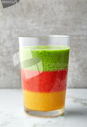 Image of glass of multicolored smoothie