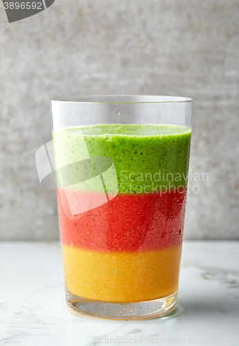 Image of glass of multicolored smoothie