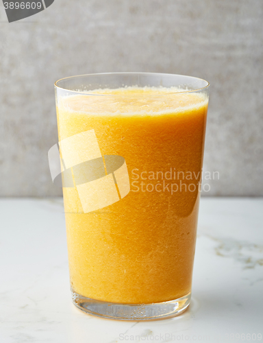 Image of glass of yellow smoothie