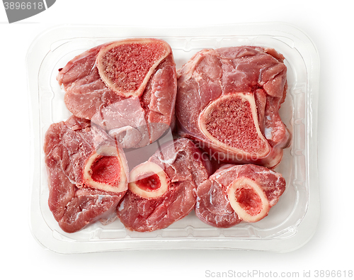 Image of raw beef cuts in plastic try