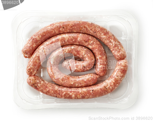 Image of raw pork sausages in plastic try