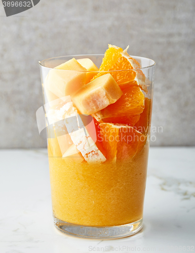 Image of glass of yellow smoothie