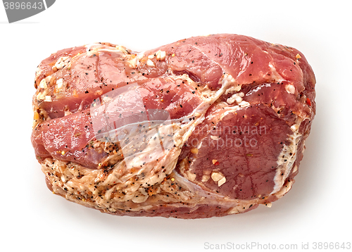 Image of raw marinated pork tenderloin