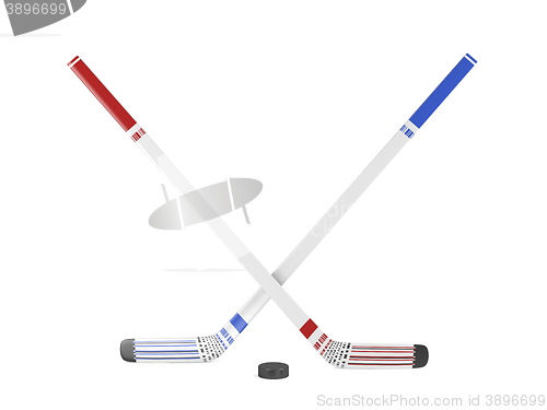 Image of Ice hockey sticks and puck