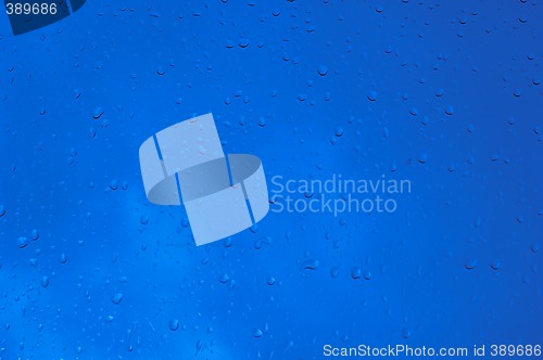 Image of Blue water drops on window