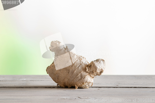 Image of Ginger root on a wooden table