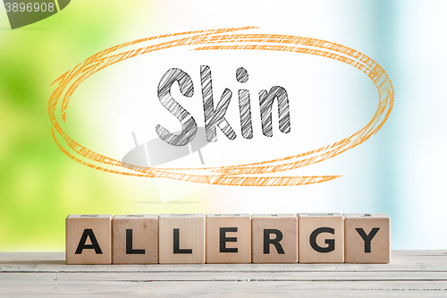 Image of Skin allergy sign on a wooden table