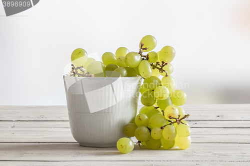 Image of White bowl with green grapes