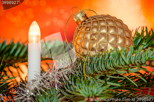 Image of Christmas lights with a golden bauble